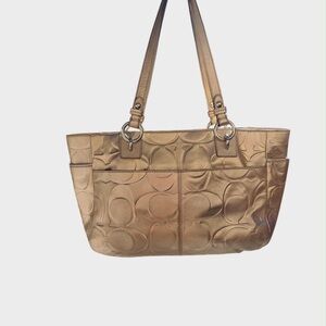 Coach Gold Embossed Tote Bag
9” tall x 15” wide